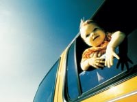 A child looking through a train window, illustrating perception.