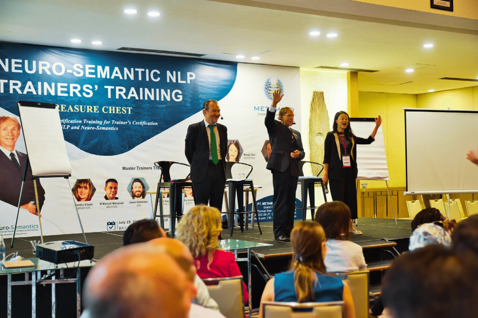 Neuro-Semantics trainers demonstrating their practice together on stage